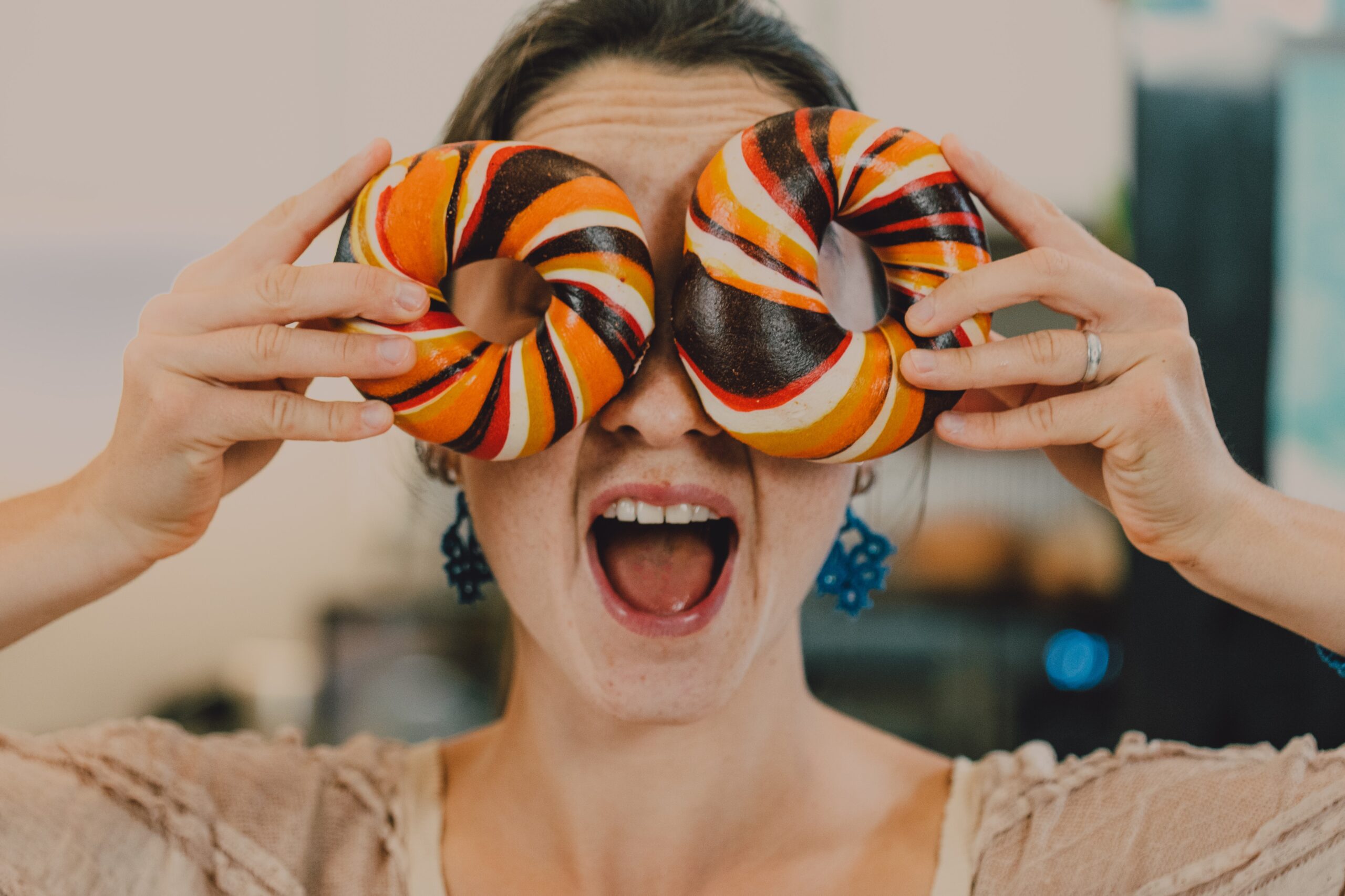 close-up-shot-of-a-person-holding-bagels