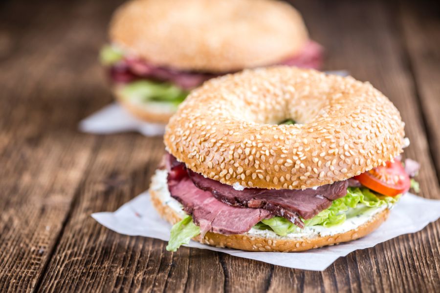 Bagel with beef on vintage background
