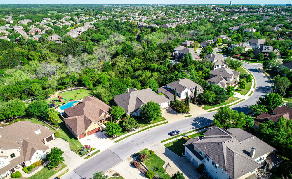 Aerial drone view above suburb homes in Austin