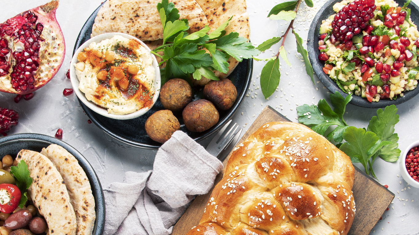 an assortment of Jewish food on the table