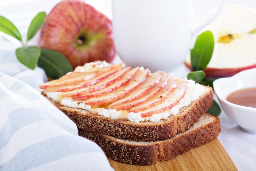 Roasted Peaches with Cardamom Ricotta and Ginger Almond Brittle