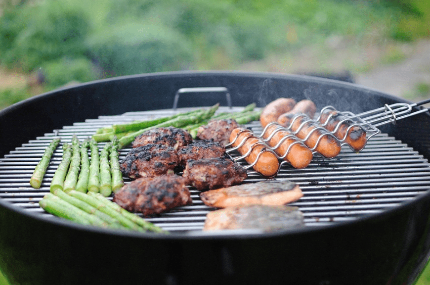 A hemispherical barbecue grill. 